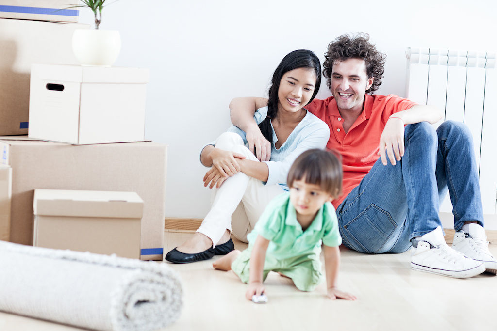 Couple with small child in apartment